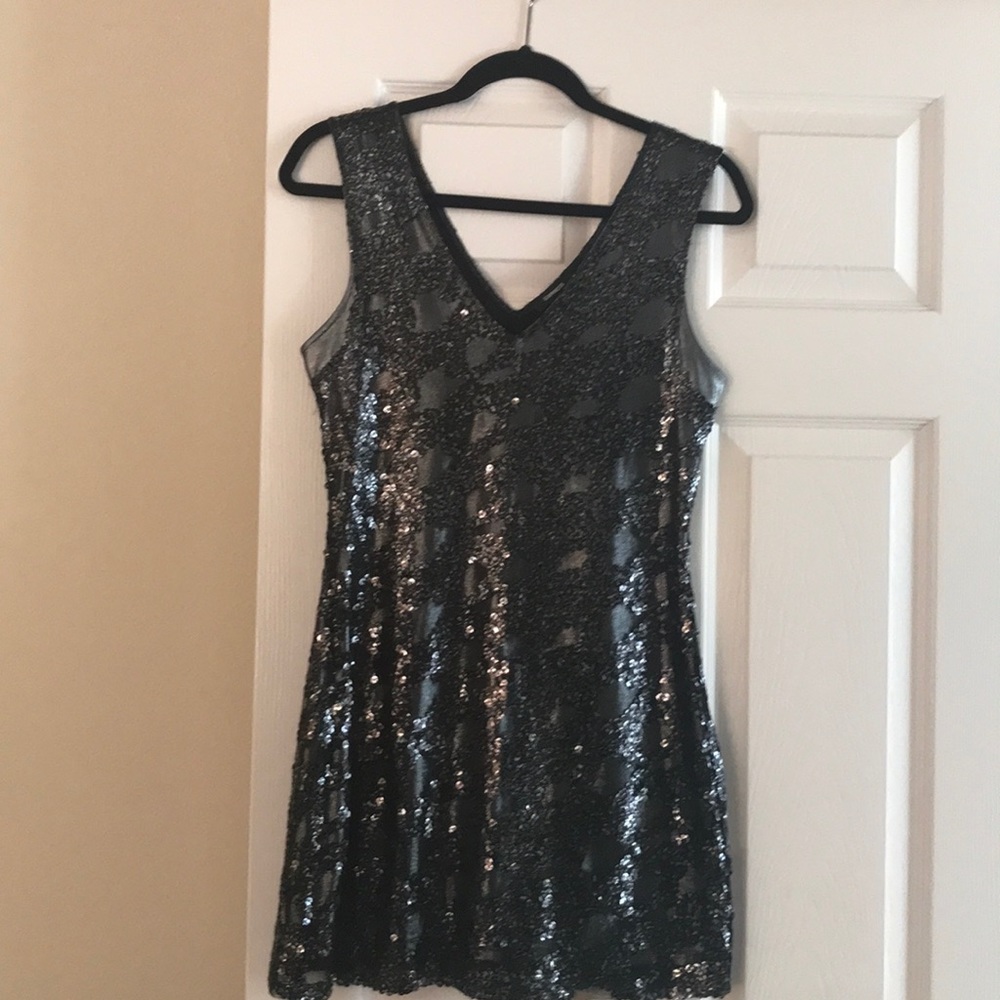 Black sequined V neck dress.